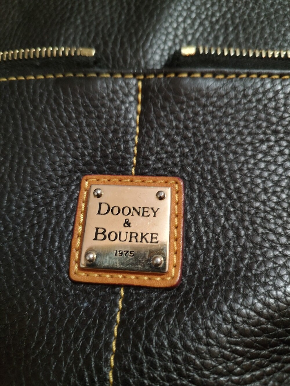 Dooney & Bourke  Black And Tan Leather Crossbody Bag with Brass Trim